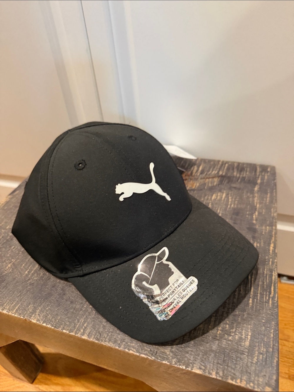 Puma Black Cap with White Logo and opening for ponytail
